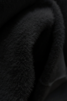 Sophia Lumina Wear black slim fit turtleneck sweater featuring a sleek, elegant design and fitted silhouette.