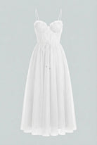 Elegant white midi dress by Lumina Wear featuring a flattering silhouette, perfect for sophisticated occasions.