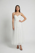 Sophia white midi dress by Lumina Wear featuring a flattering silhouette and elegant design, perfect for formal occasions.