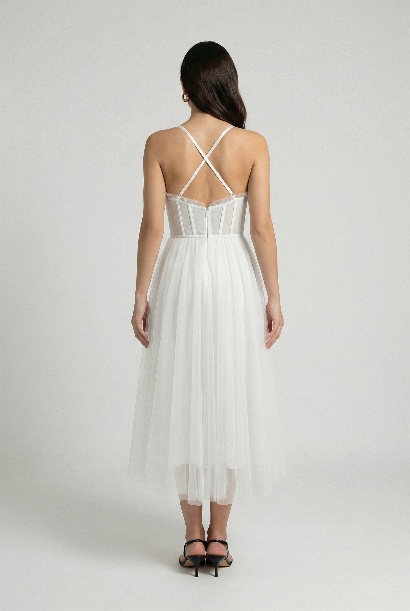Elegant white midi dress by Lumina Wear featuring a flattering silhouette, perfect for sophisticated occasions.
