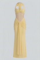 Elegant yellow halter dress with ruched detail by Lumina Wear, featuring a fitted bodice and stylish design.
