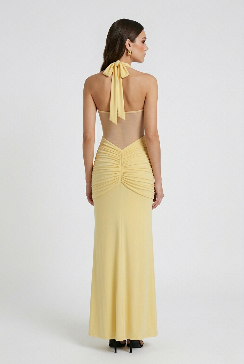 Elegant yellow halter dress with ruched detail from Lumina Wear, featuring a fitted style and stylish design.