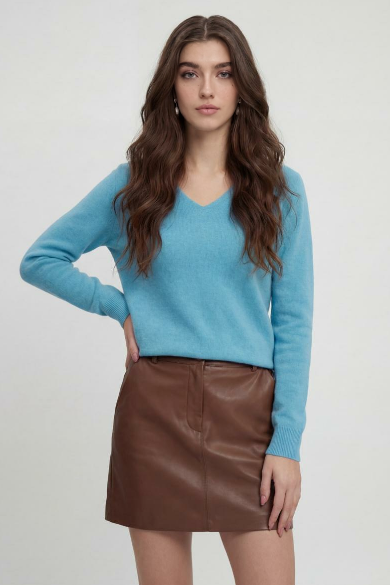 Light blue V-neck women's sweater with a fitted silhouette from Lumina Wear, featuring a flattering, stylish design.