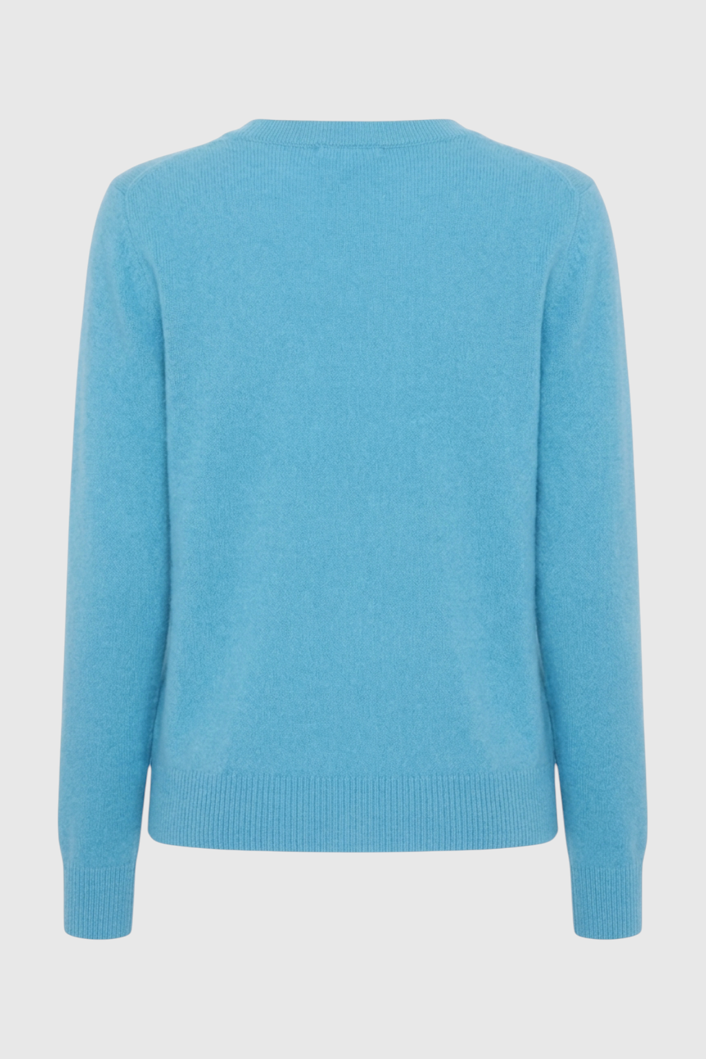 Light blue V-neck women's sweater by Lumina Wear featuring a fitted silhouette and flattering fit, displayed on a model.