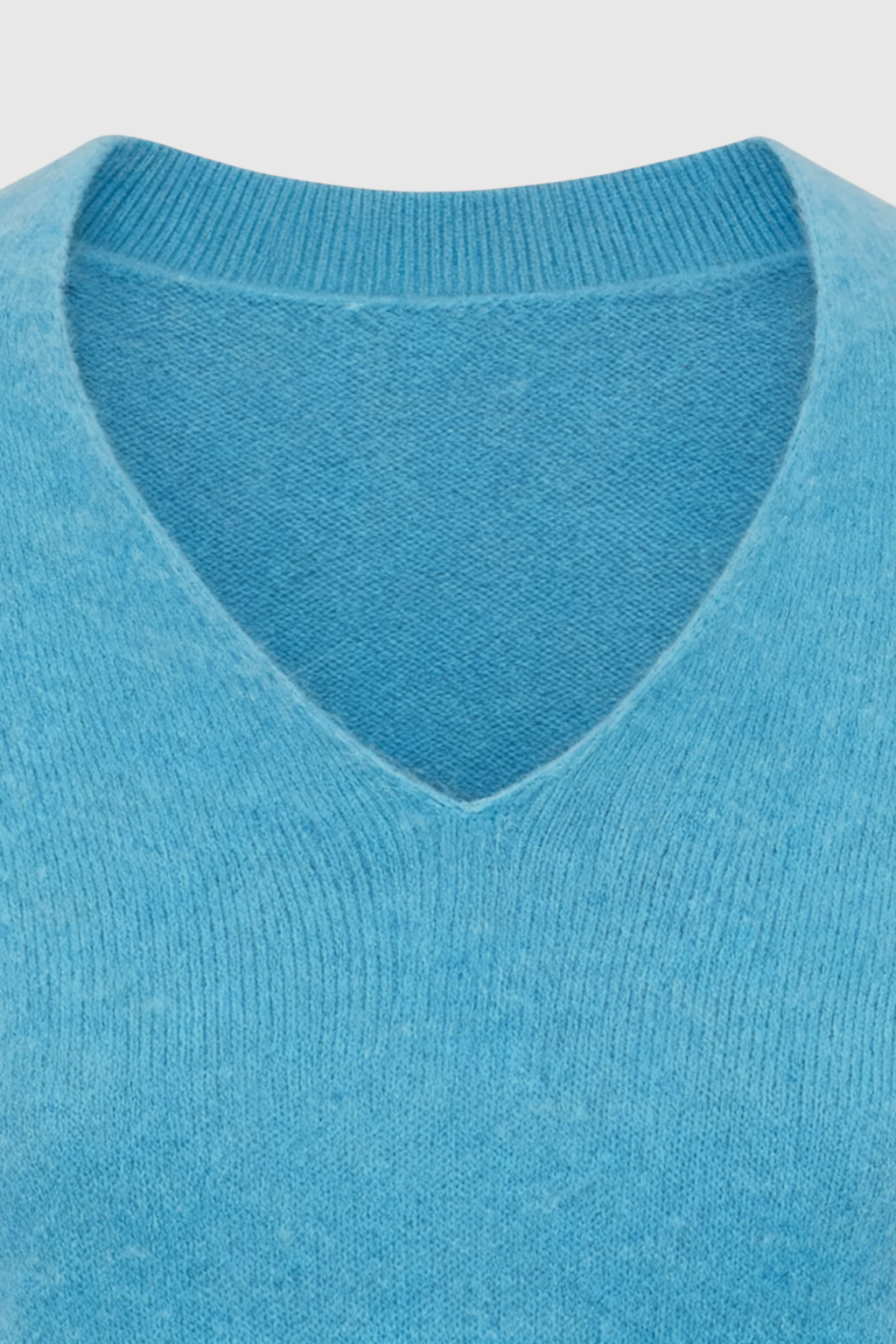 Light blue V-neck women's sweater from Lumina Wear featuring a fitted silhouette, displayed on a neutral background.