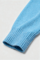 Light blue Lumina Wear Sophia V-neck women's sweater with a fitted silhouette, featuring a flattering V-neck design.