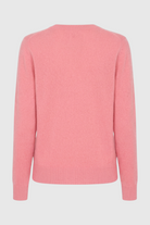 Pink Lumina Wear Sophia V-neck knit sweater with long sleeves, featuring a flattering design and cozy knit texture.