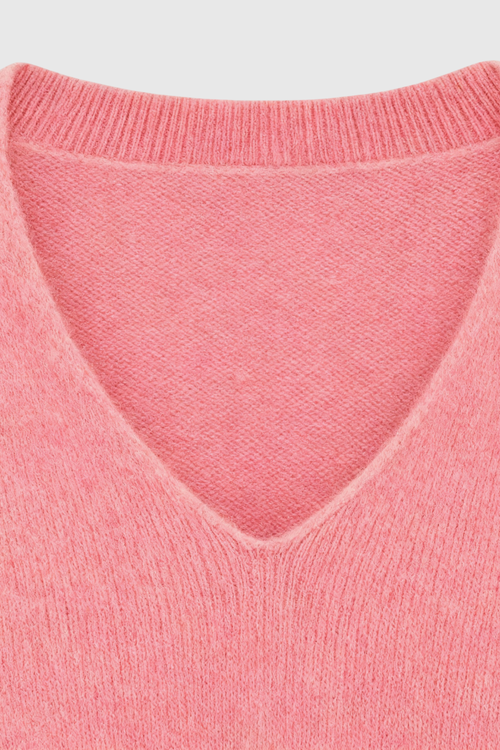 Pink Lumina Wear Sophia V-neck knit sweater with long sleeves, featuring a flattering design and cozy knit texture.