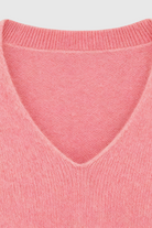Pink Lumina Wear Sophia V-neck knit sweater with long sleeves, featuring a flattering design and cozy knit texture.