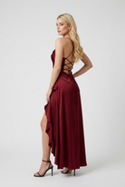 Sophia Lumina Wear flowing red maxi dress with asymmetric hem, lightweight fabric, and elegant design for women's dresses.