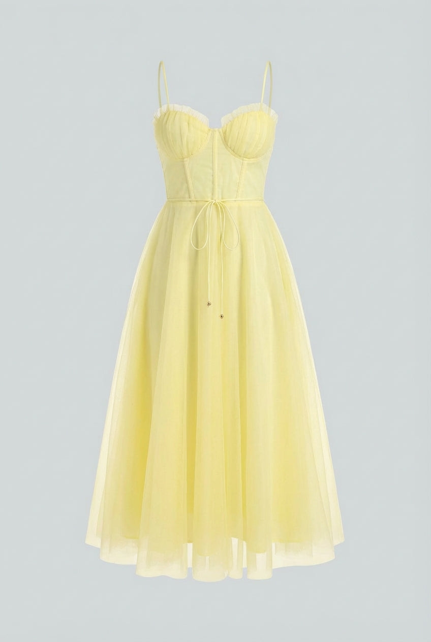 Flowy yellow midi dress from Lumina Wear featuring an elegant design, displayed on a model showcasing its stylish silhouette.