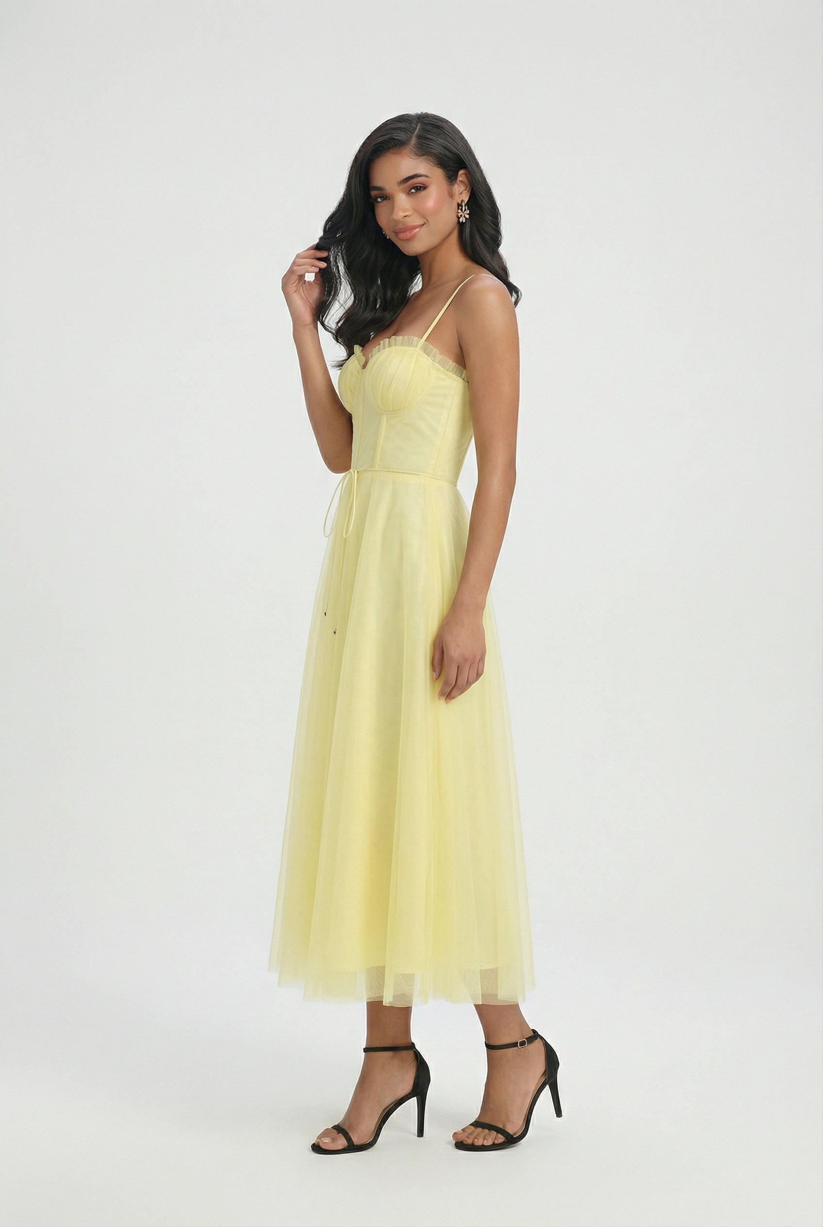 Lumina Wear Sophia yellow flowy midi dress with elegant design, showcased on a model. Perfect for stylish occasions.