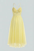 Flowy yellow midi dress from Lumina Wear featuring an elegant design, perfect for stylish occasions.