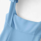 Lumina Wear Sophia playful bow-detail crop top with zipper closure in blue, designed for women, shown in XS size.