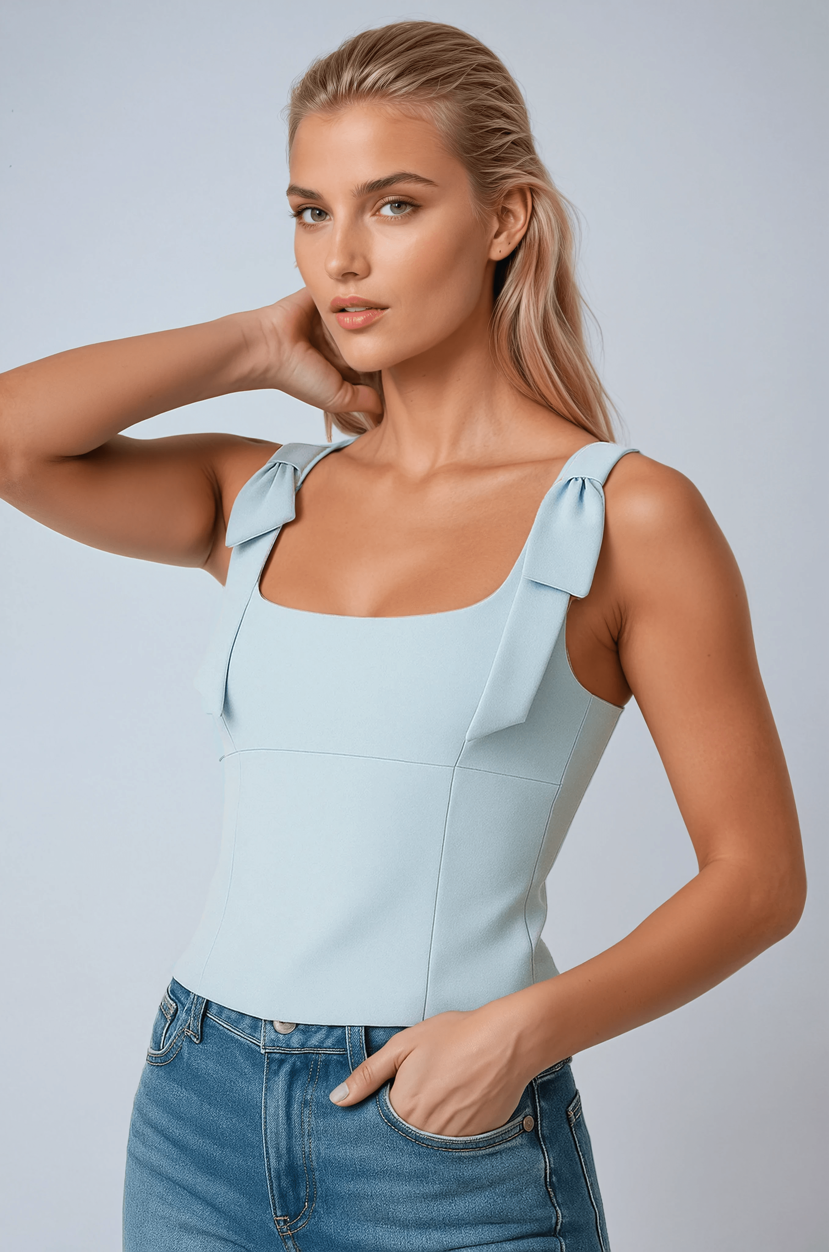 Lumina Wear Sophia women's crop top with playful bow detail and zipper closure, blue, size XS, stylish and trendy women's top.