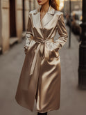 Sophia Lumina Wear trench coat in refined champagne satin, showcasing sleek design and elegant fabric.