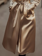 Sophia trench coat in refined champagne satin by Lumina Vancouver, stylish and elegant coat with a smooth satin finish.