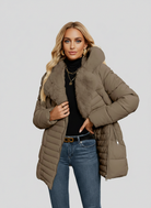 Black women's longline puffer coat with faux-fur collar by Lumina Wear, featuring a sleek design and cozy winter style.