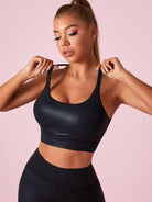 Black Lumina Vancouver matte leather I-shaped sports bra with sleek, supportive design, shown in XS size.