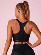 Black Lumina Vancouver matte leather I-shaped sports bra, shown in XS size, designed for athletic support and comfort.