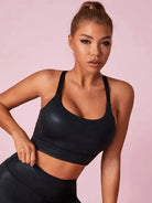 Black matte leather I-shaped sports bra by Lumina Vancouver, showcasing a sleek, supportive design perfect for active wear.