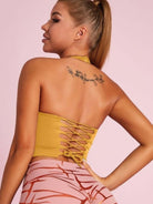 Black Lumina Vancouver sports bra with Roman knot halter design and beautify back detail, ideal for active wear.