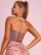 Black Lumina Vancouver sports bra with Roman knot halter design and beautify back detailing, ideal for active wear.