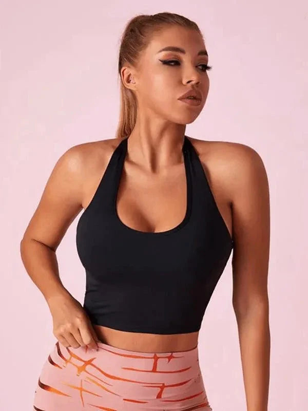 Black Lumina Vancouver sports bra with Roman knot halter design and beautify back detail, designed for active wear and support.