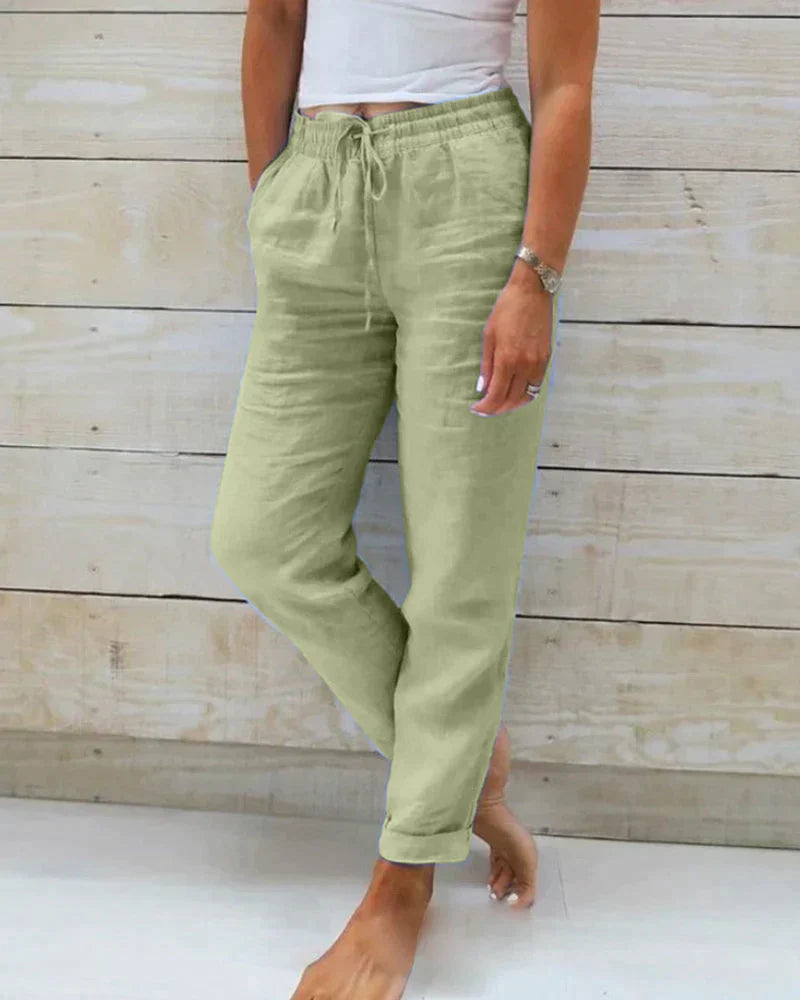 Light beige linen trousers for women by Lumina Wear, modern fit Stacy lightweight linen pants, shown in green XS size.