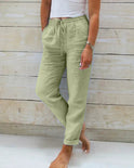 Light beige linen pants for women by Lumina Wear, featuring a modern fit and lightweight fabric, shown on a model.