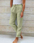 Light beige linen trousers for women by Lumina Wear, modern fit Stacy lightweight linen pants, shown in green XS size.