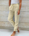 Lightweight beige linen pants for women by Lumina Wear, featuring a modern fit and casual style, shown in XS size.