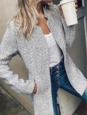 Light grey Stella mid-length coat by Lumina Wear with pockets, stylish and elegant for a sophisticated winter look.