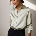 Lumina Wear Stella satin blouse with classic button-down design in green, featuring elegant long sleeves and tailored fit.