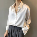 Green satin blouse with classic button-down design by Lumina Wear, featuring a stylish and elegant fit.