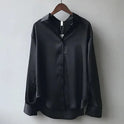 Lumina Wear Stella satin blouse with classic button-down design in green, featuring elegant style and tailored fit.