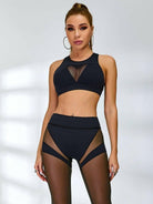Black Lumina Vancouver sheer mesh sports bra with breathable design and adjustable straps for comfortable active wear.