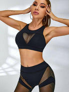 Black Lumina Vancouver sheer mesh sports bra with breathable design and supportive fit, ideal for active wear.