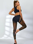 Black Lumina Vancouver sheer mesh sports bra with a supportive design and stylish, breathable fabric for active wear.