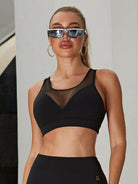 Black mesh sports bra from Lumina Vancouver, featuring a sleek, sexy design perfect for activewear and workout sessions.