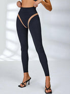 Black Lumina Vancouver mesh sports bra with sheer, breathable fabric and unique design for active wear.