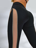Black Lumina Vancouver sheer mesh sports bra with a sexy, unique design and supportive fit, perfect for active wear.