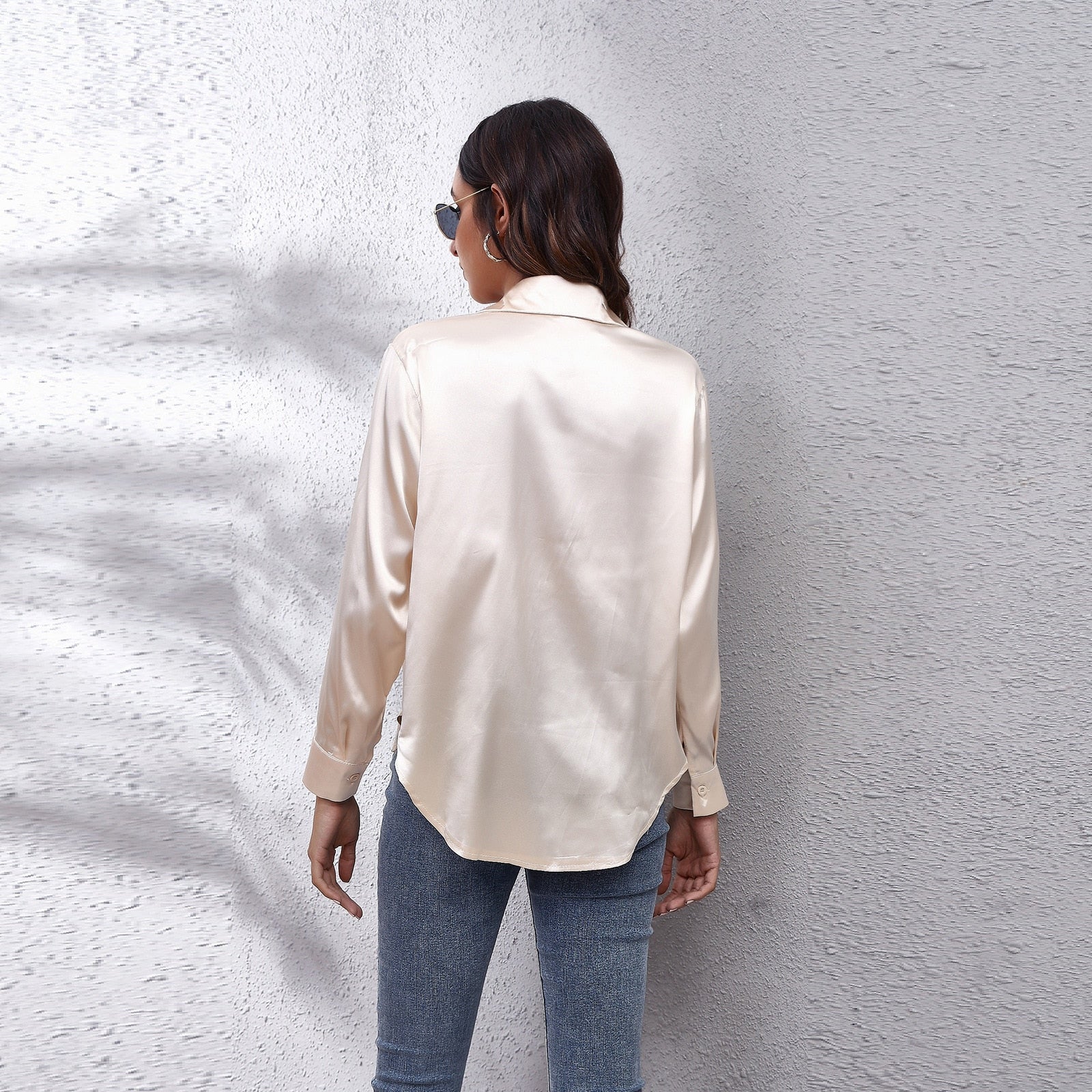 Light blue Lumina Wear Sydney relaxed fit satin blouse for women, showcasing smooth fabric and timeless design.