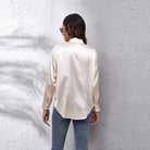 Light blue Lumina Wear Sydney relaxed fit satin blouse for women, showcasing smooth fabric and timeless design.