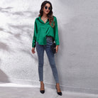 Light blue Lumina Wear Sydney relaxed fit satin blouse for women, showcasing elegant design and soft, smooth fabric.