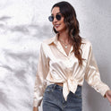 Light blue Lumina Wear Sydney satin blouse with relaxed fit and timeless design, shown on a woman against a neutral background.