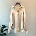 Beige Taylor Lumina Wear relaxed fit blouse with button detail, featuring a stylish, comfortable design and elegant silhouette.