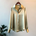 Beige Taylor Lumina Wear relaxed fit blouse with button details, shown on a model, highlighting its elegant, casual style.