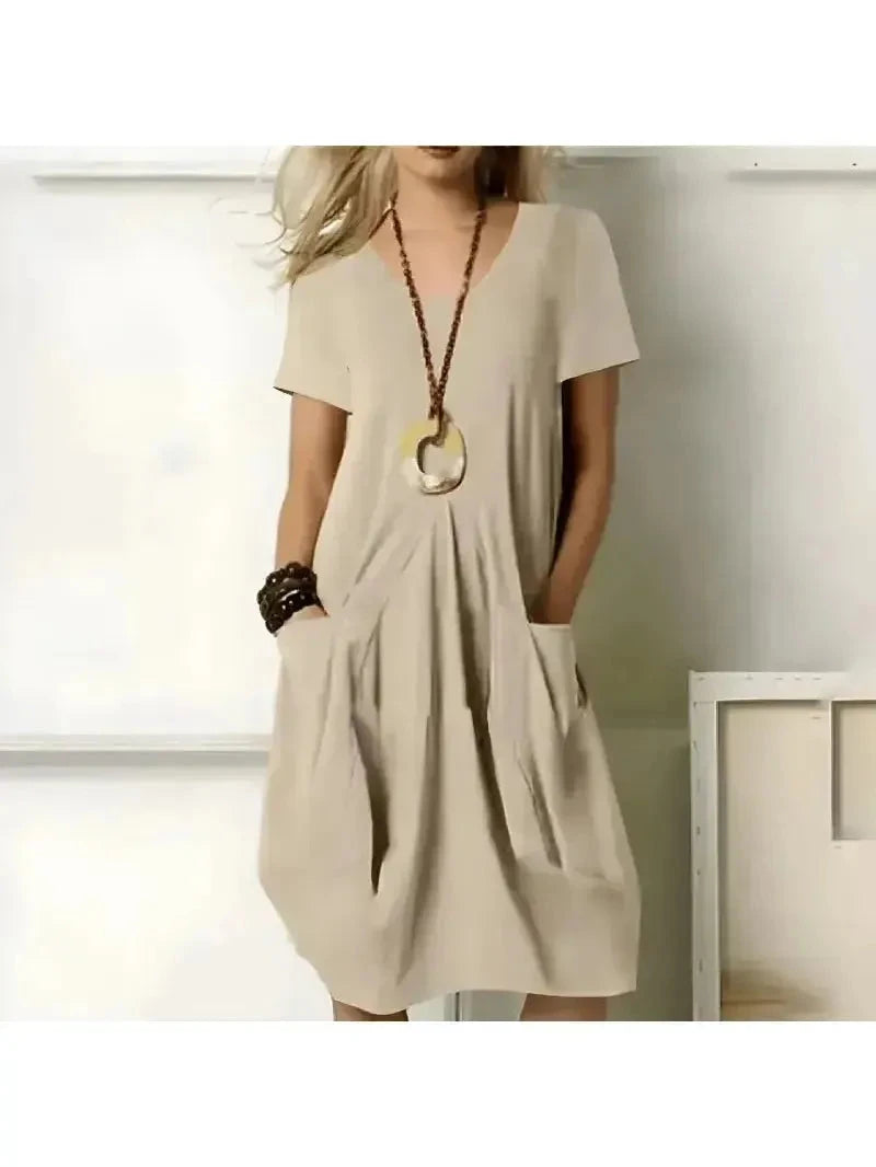 Lumina Vancouver Tia stylish green one-color dress with flattering tummy coverage, perfect for casual or elegant occasions.
