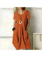 Green Tia stylish one-color dress by Lumina Vancouver featuring flattering tummy coverage and a chic, comfortable fit.